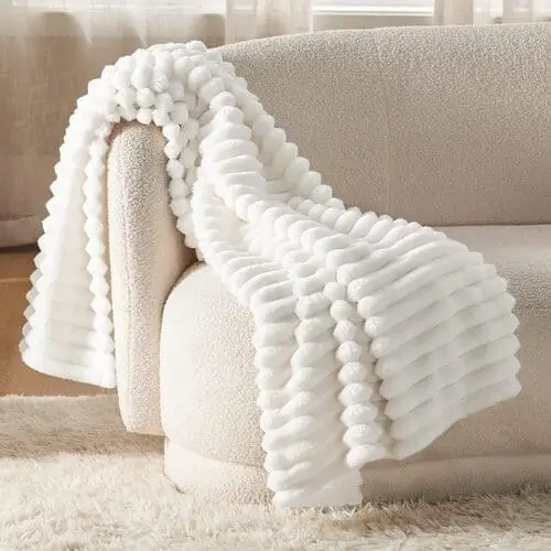 Super soft white throw blanket for couch, perfect for women looking to add a cozy, chic touch to their living room or bedroom. Ideal for lounging, movie nights, or snuggling up during cold weather.