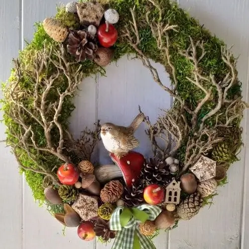 Woodland autumn wreath featuring natural elements like pinecones, acorns, and rustic leaves, perfect for bringing a cozy, forest-inspired touch to your fall decor.