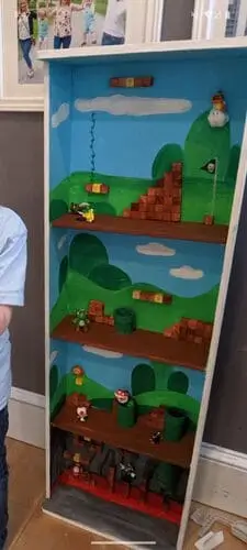 DIY painted Super Mario bookcase – a creative bookshelf transformed into a fun playhouse for kids. Find step-by-step Super Mario decor ideas on our website!