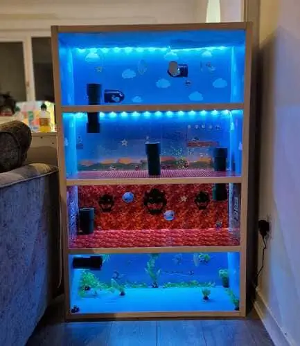 DIY action figure playhouse with LED lights, made from an upcycled bookcase – a creative play space for kids. Discover more upcycling ideas on our blog!