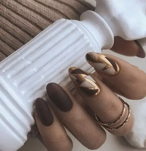 Chic brown, white, and metallic nails—stylish nail art inspiration for a modern and glamorous manicure look.