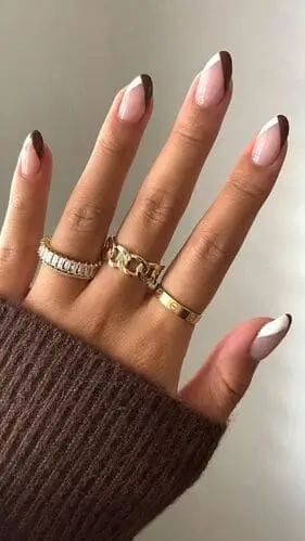 Modern crossing brown and white French manicure—elegant nail design inspiration for a unique, trendy twist on classic French tips.