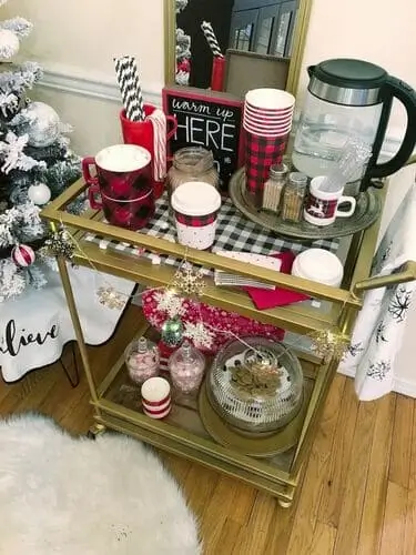 Festive hot cocoa bar cart with mugs, toppings, and holiday decor – perfect for Christmas parties and cozy winter gatherings, offering a stylish and convenient setup.