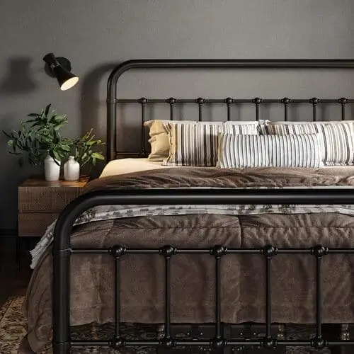 Elegant iron bedframe for a Mediterranean-inspired bedroom, featuring intricate detailing and rustic charm, perfect for creating a coastal, sun-soaked retreat.