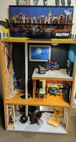 DIY superhero clubhouse with fireman pole and climbing wall – an exciting playhouse idea for kids. Explore more superhero clubhouse designs on our blog!