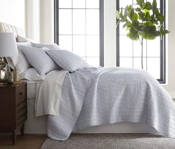 Classic ticking striped bedding perfect for cottage bedroom inspiration, available on Amazon—add timeless charm and cozy comfort to your bedroom decor.