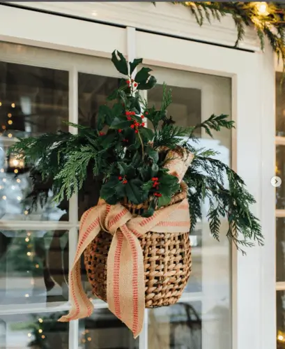 Hang holly and Christmas greens on front door for beautiful Christmas door decor