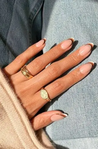 Trendy brown and white retro French tip nails—chic nail art inspiration perfect for Gen Z looking for a nostalgic yet modern manicure.