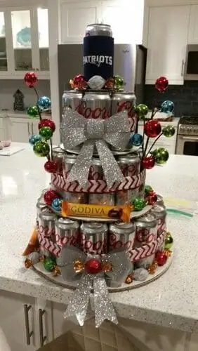 Beer tower made out of his favorite beer for Christmas. Wrap it in decorations from Dollar Tree for a beautiful presentation.