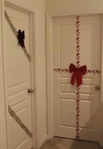 Christmas door decoration ideas: Easy wrapping paper bedroom door design for a festive holiday touch.