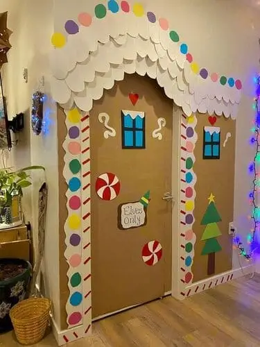 Festive gingerbread house door with candy decorations, a fun Christmas door decoration idea