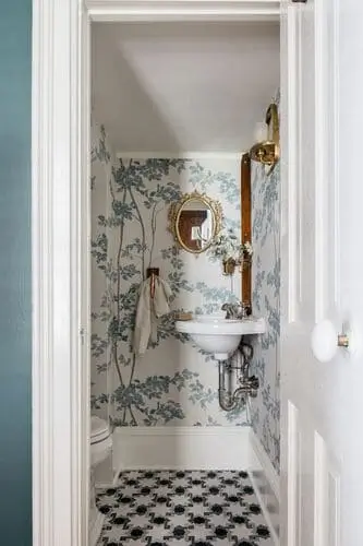 Small bathroom featuring a corner sink with white basin, perfect for tight layouts.