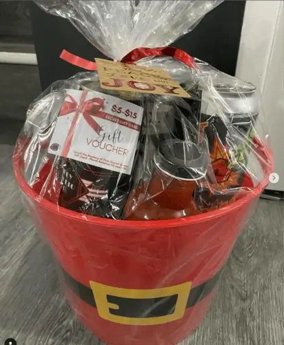 Craft beer christmas gift basket for men filled with local craft beer, gift card to a local brewery or sports bar, snacks and treats, and more.