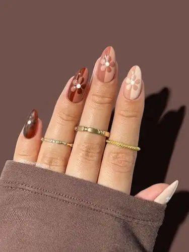 Half and half gradient flower nails in white, tan, and brown—unique nail design with gradient background and floral accents for a chic, earthy vibe.