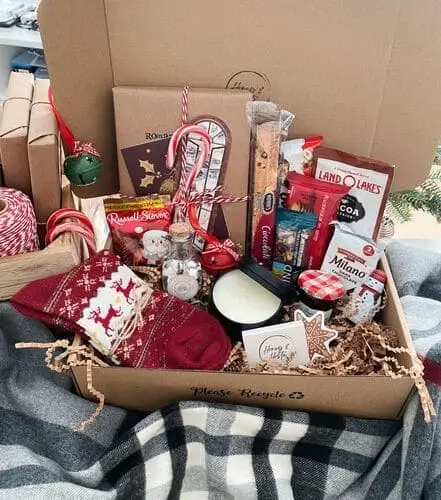 Bookworm’s Christmas basket featuring coffee, a bookmark set, and warm socks.