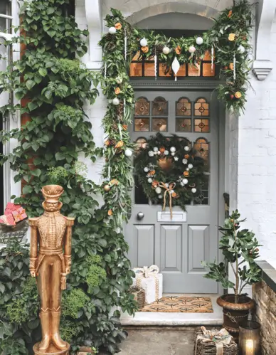 Holiday decor featuring dried orange slices, white baubles, and pinecones arranged for a natural Christmas touch; festive, eco-friendly decoration idea with rustic elegance perfect for seasonal displays.