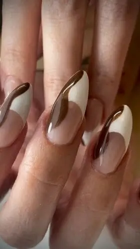 Modern brown and white nails with white French tips and a stylish swipe of medium chocolate brown polish—chic, contemporary nail art inspiration.