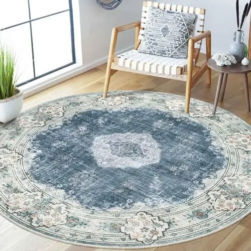 Blue circular rug to layer over jute rug in maximalist blue living room