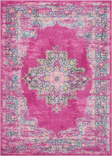 Bright pink boho rug adds pop of color for cute apartment decor