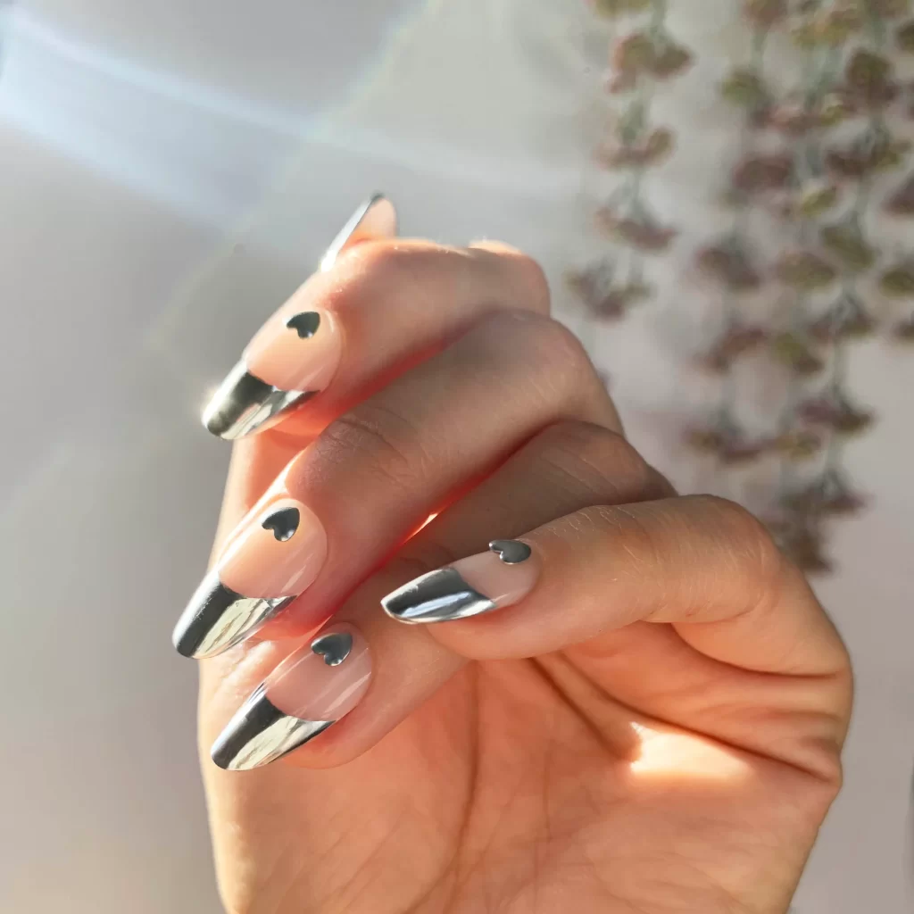 Chrome French tips with a sleek and modern design, perfect for a trendy and futuristic manicure.