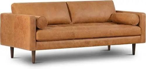 Cognac tan retro leather sofa works beautifully in retro maximalist living room