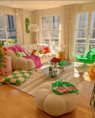 Neutral maximalist living room with green and pink accents