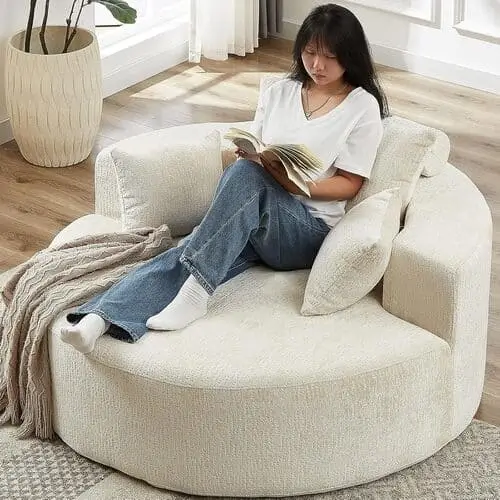 Cute oversized chaise lounge chair makes the perfect cute reading nook to make your apartment decor look fabulous