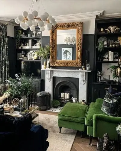 Dark maximalist living room in dark green, back, and cream theme. Makes an absolutely gorgeous result.