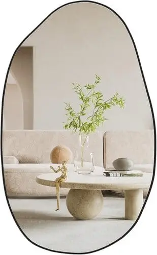 Irregular wall mirror for cute apartment decor, adding a unique, artistic touch while enhancing light and depth in any room.