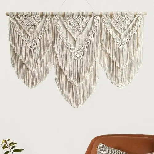 Chic macrame wall art adds texture and warmth to cute apartment decor, ideal for a modern bohemian aesthetic.