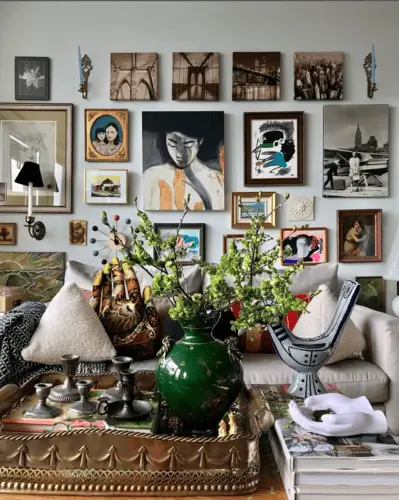 Maximalist living room walls using framed photos, prints, and art work for a beautiful collection