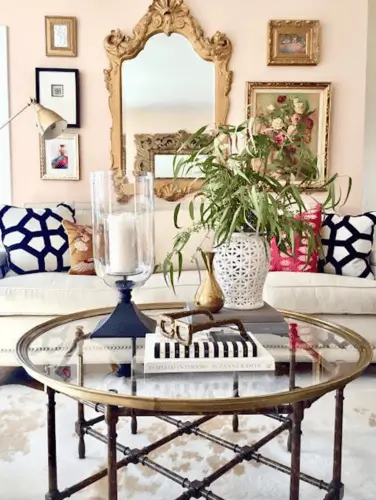 Use a mirror as a focal point and surround it with floral and feminine art for cute apartment decor