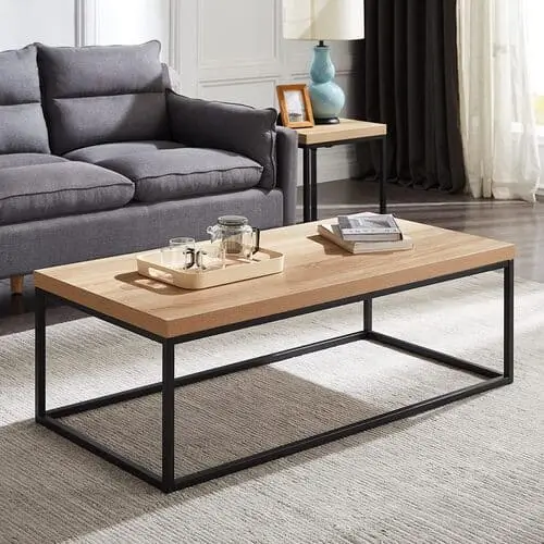 Sleek oak coffee table with simple lines, perfect for minimalist and modern apartment living room designs.