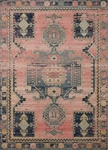 Feminine Aztec-patterned rug in soft pink and rose tones, ideal for adding warmth and personality to any living space.