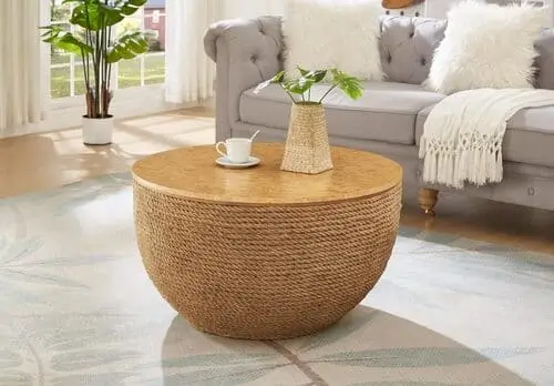 Round woven coffee table to add natural element to blue maximalist living room