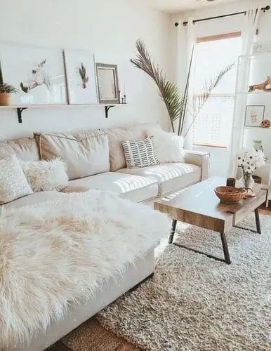 Layered wall art above sofa in beautiful neutral western prints