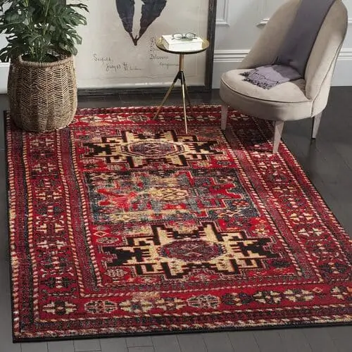 red vintage boho rug for maximalist boho living room 