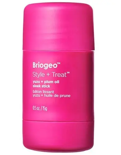 Briogeo Sleek Stick smoothing down stubborn flyaways, ideal for taming curls and creating sleek hairstyles.