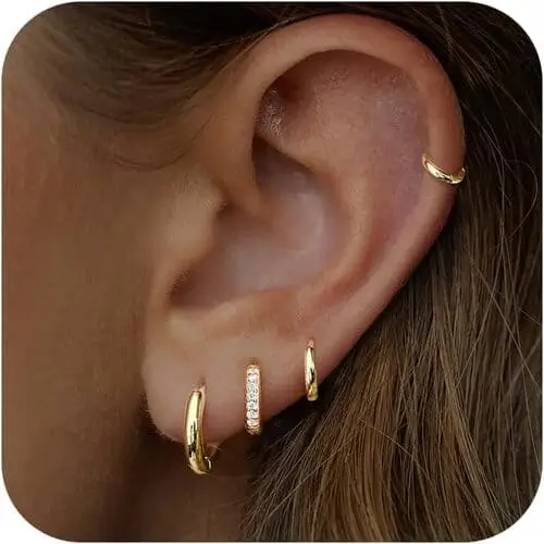 Dainty gold earrings are perfect for a vanilla girl aesthetic