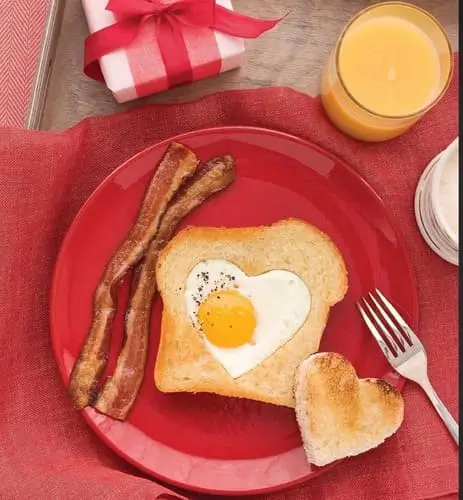 Heart-shaped egg in a hole breakfast is a cute and healthy Valentine's breakfast idea. Serve with bacon or sausage, fruit, and a glass of fresh juice for a sweet and wholesome breakfast