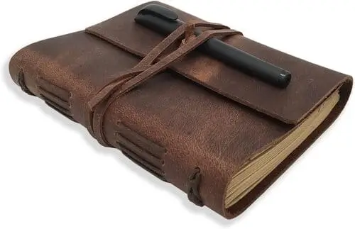 Leather-bound notebook with vintage vibes, perfect for jotting down poetic thoughts or sketching in style.